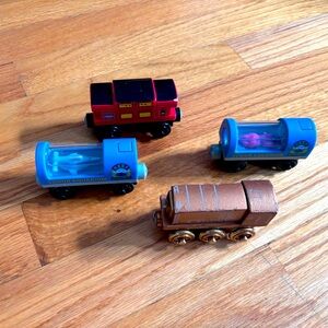 Lot of four rare wood Thomas trains - some with light or music features